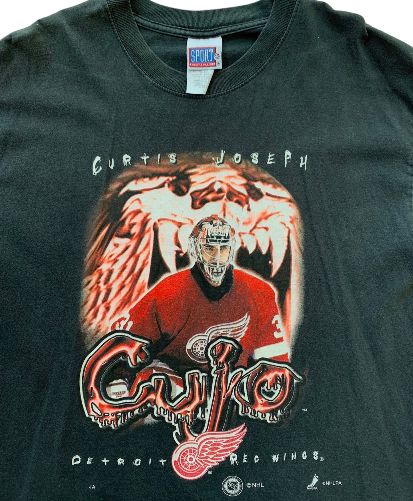 Curtis Joseph Tee (L)